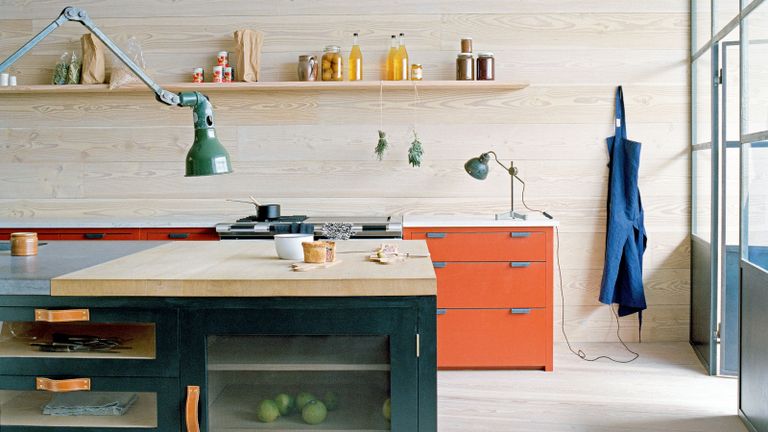 roost episode 6 - modern retro kitchen with orange and navy cupboards - Credit-Plain-English