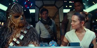 Chewie, Rey, Finn and Poe in the cockpit of the Millennium Falcon