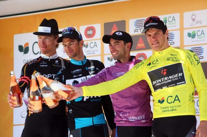 Volta ao Alentejo stage 4 winner Tom Zirbel, left, on stage with the jersey holders.