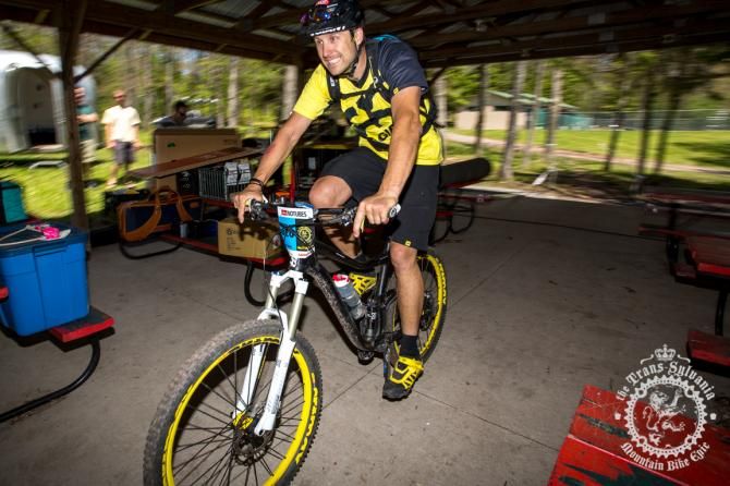 Jeff Lenosky smiles as he swings through the campsi te as a part of the TSEpic time trial course