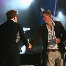 Sir Elton John, HRH Prince Harry and HRH Prince William on stage during The Concert For Diana held at Wembley Stadium on July 1, 2007 in London. The concert marked the 10th anniversary of Princess Diana' s death with an event to celebrate her life.