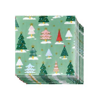 A stack of green napkins with colorful Christmas tree motifs on them