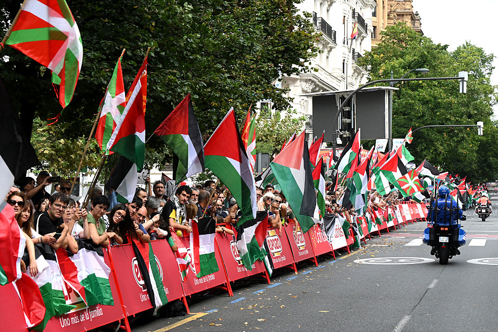 BILBAO, SPAIN - SEPTEMBER 03: A group of fans protest against Team Israel - Premier Tech riders by displaying Palestinian flags at arrival during the La Vuelta - 80th Tour of Spain 2025, Stage 11 a 157.4km stage from Bilbao to Bilbao / #UCIWT / on September 03, 2025 in Bilbao, Spain. (Photo by Dario Belingheri/Getty Images)