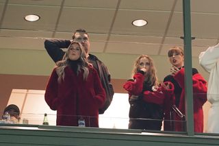 Lyndsay Bell, Brittany Mahomes and Taylor Swift react in a suite during the game between the Kansas City Chiefs and the Green Bay Packers at Lambeau Field on December 03, 2023 in Green Bay, Wisconsin.