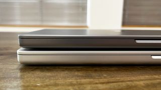 MacBook Pro 2021 14 inch on top of 16 inch model, viewed from the side