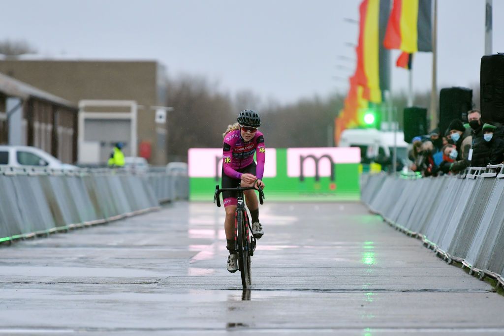 MIDDELKERKE BELGIUM JANUARY 08 Laura Verdonschot of Belgium crosses the finishing line in third place during the 105th Belgian National Cyclocross Championships 2022 Womens Elite bkmiddelkerke on January 08 2022 in Middelkerke Belgium Photo by Luc ClaessenGetty Images