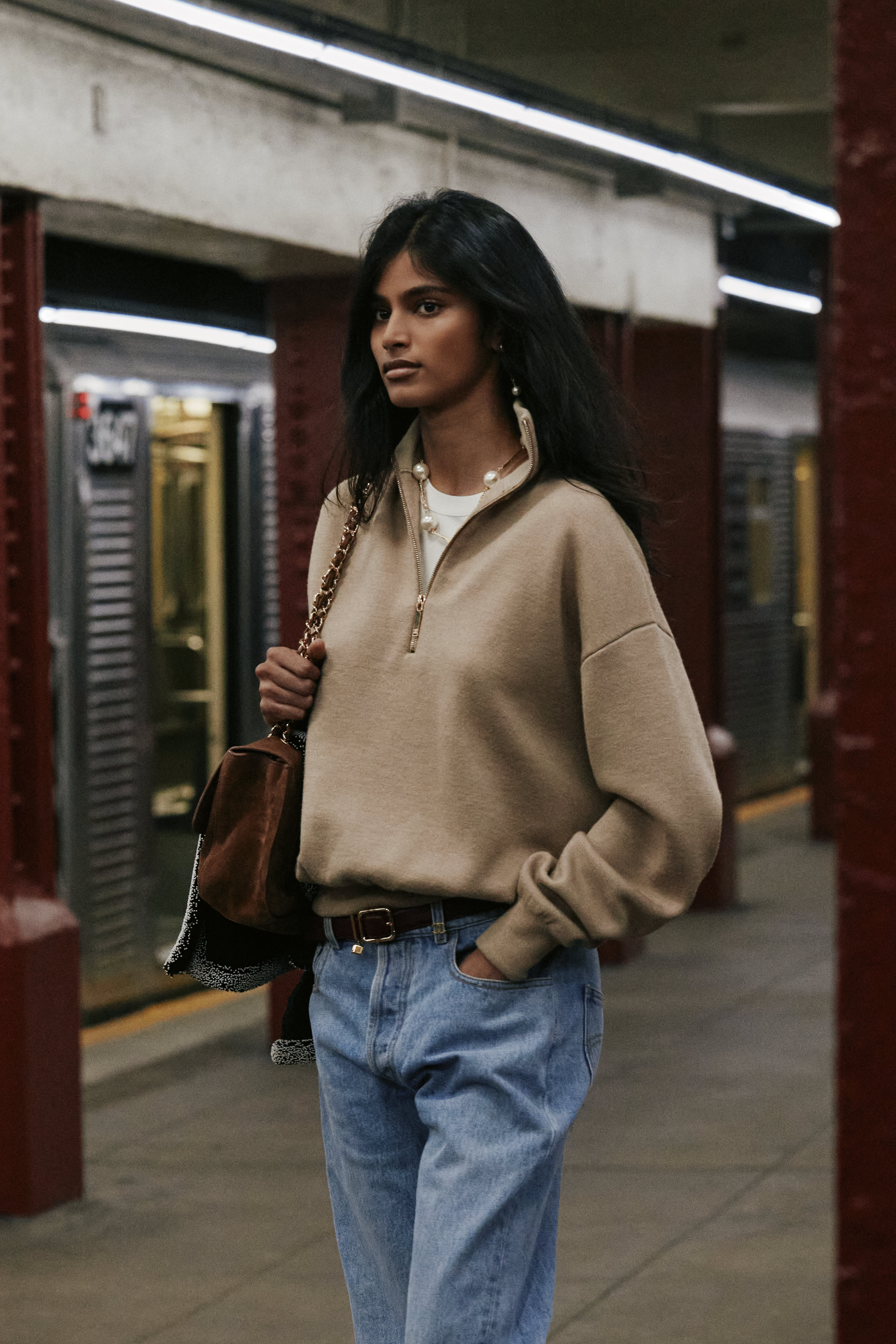 An image of Indian supermodel Bhavitha Mandava wearing the Chanel quarter-zip knit on the M&eacute;tiers d'art 2026 runway.