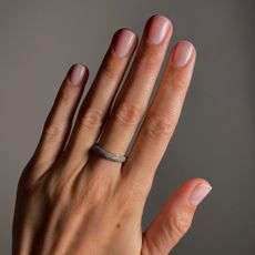 A picture of a short, powder pink, matte manicure