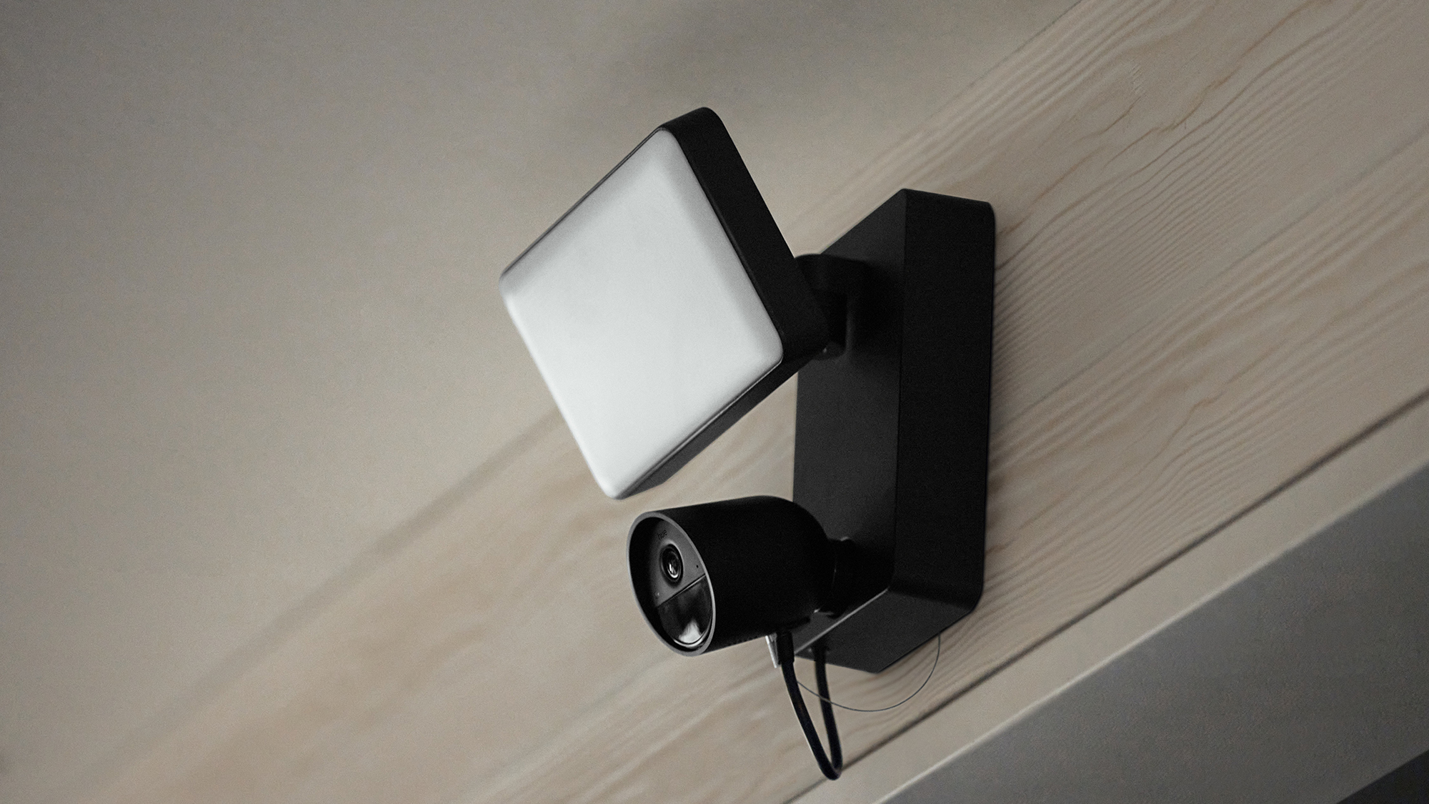 Philips Hue Secure floodlight camera on an external wall