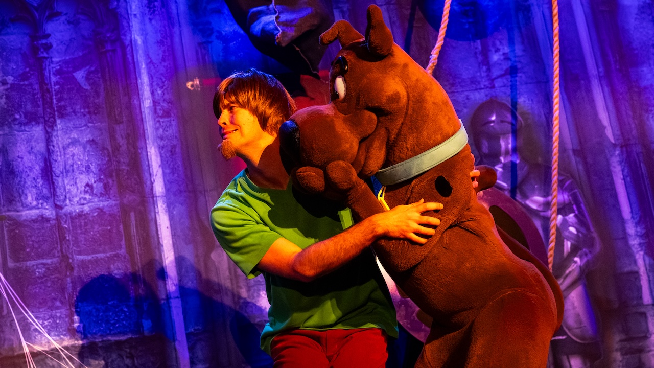 Shaggy and Scooby-Doo huddled together in fear