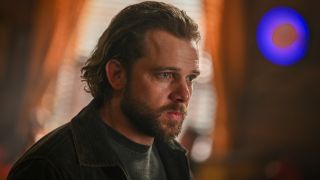 Max Thieriot as Bode looking intensely in Fire Country.