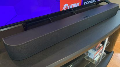 The Roku Streambar Pro in front of a big-screen TV