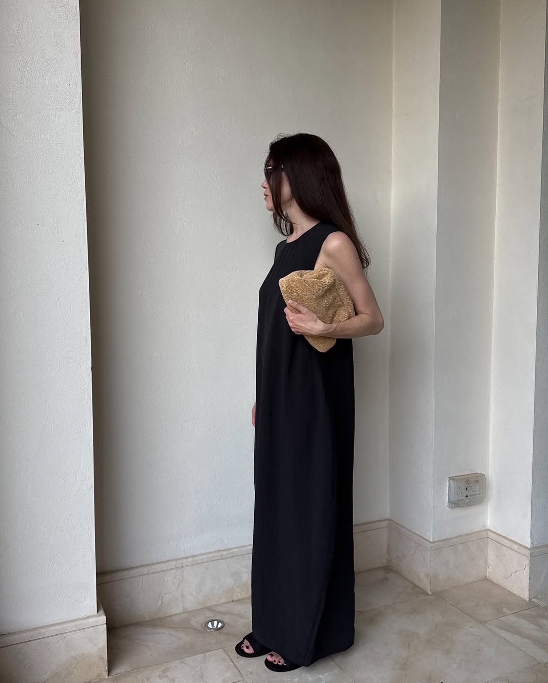 @annabelrosendahl wearing black dress and slides