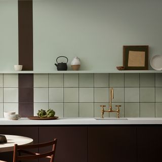 kitchen with golden tap and square tiles