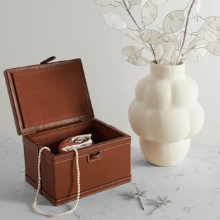 A brown leather decorative box