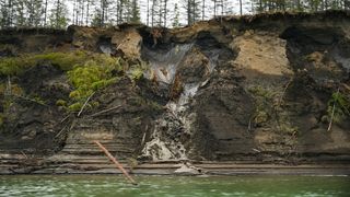 Permafrost melts into the Kolyma River outside of Zyryanka, Russia in Siberia on July 4, 2019. In a new study, researchers looked for ancient viruses in several places in Siberia, including two rivers.