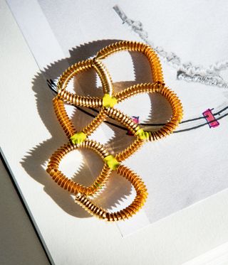 gold necklace with coloured beads