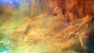 This image taken by Hubble Telescope shows Lagoon Nebula. After the Big Bang, large quantities of the rare gas helium-3 were made, and these gas particles became part of nebulas, one of which later gave rise to our solar system. The amount of helium-3 leaking from Earth's metallic core indicates that our planet formed inside a nebula with high helium-3 concentrations.