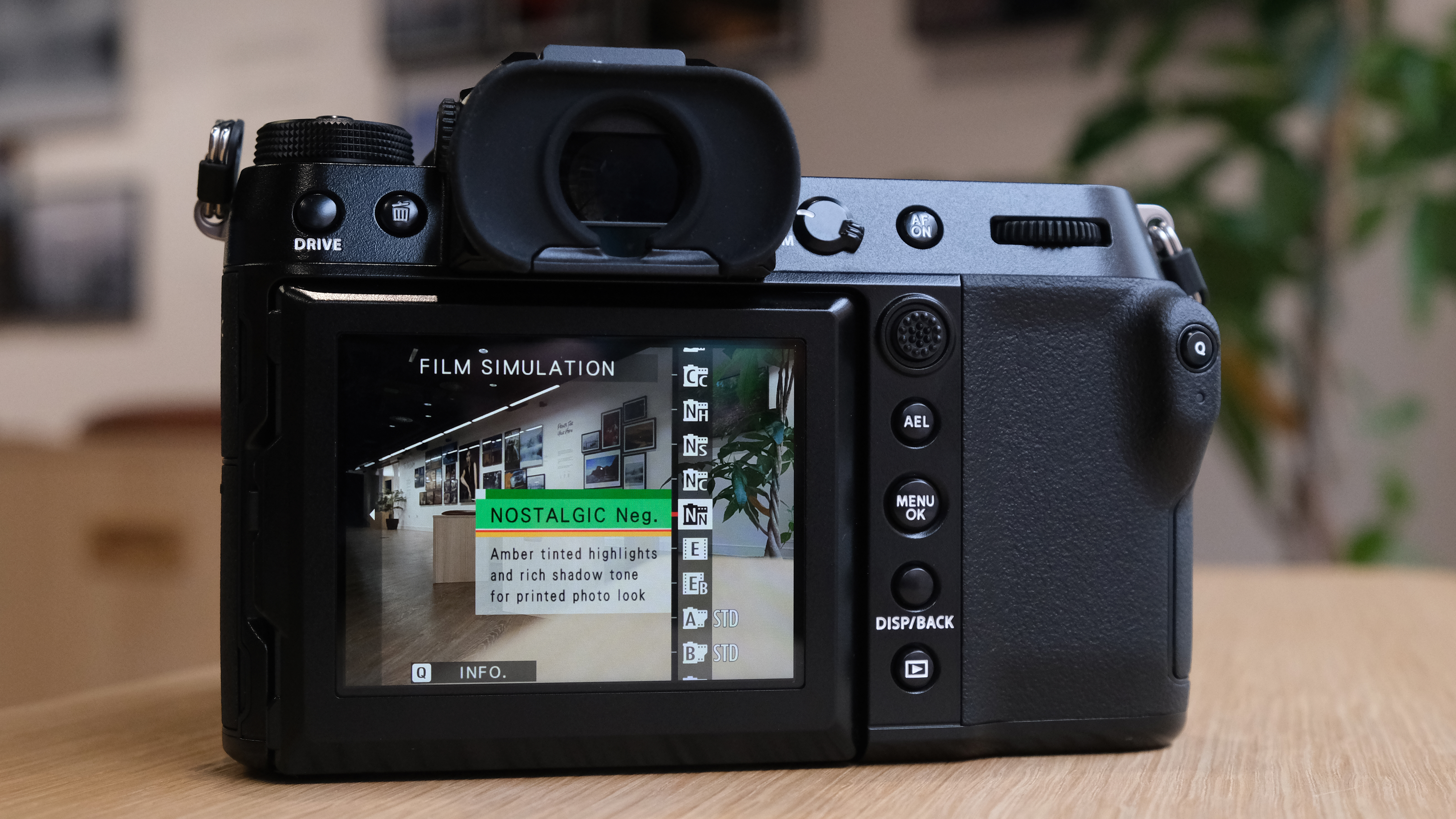 The Fujifilm GFX50S II on a wooden table