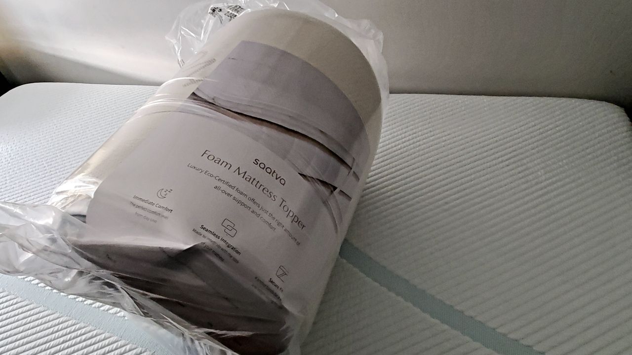 Saatva Foam Mattress Topper during various stages of set-up