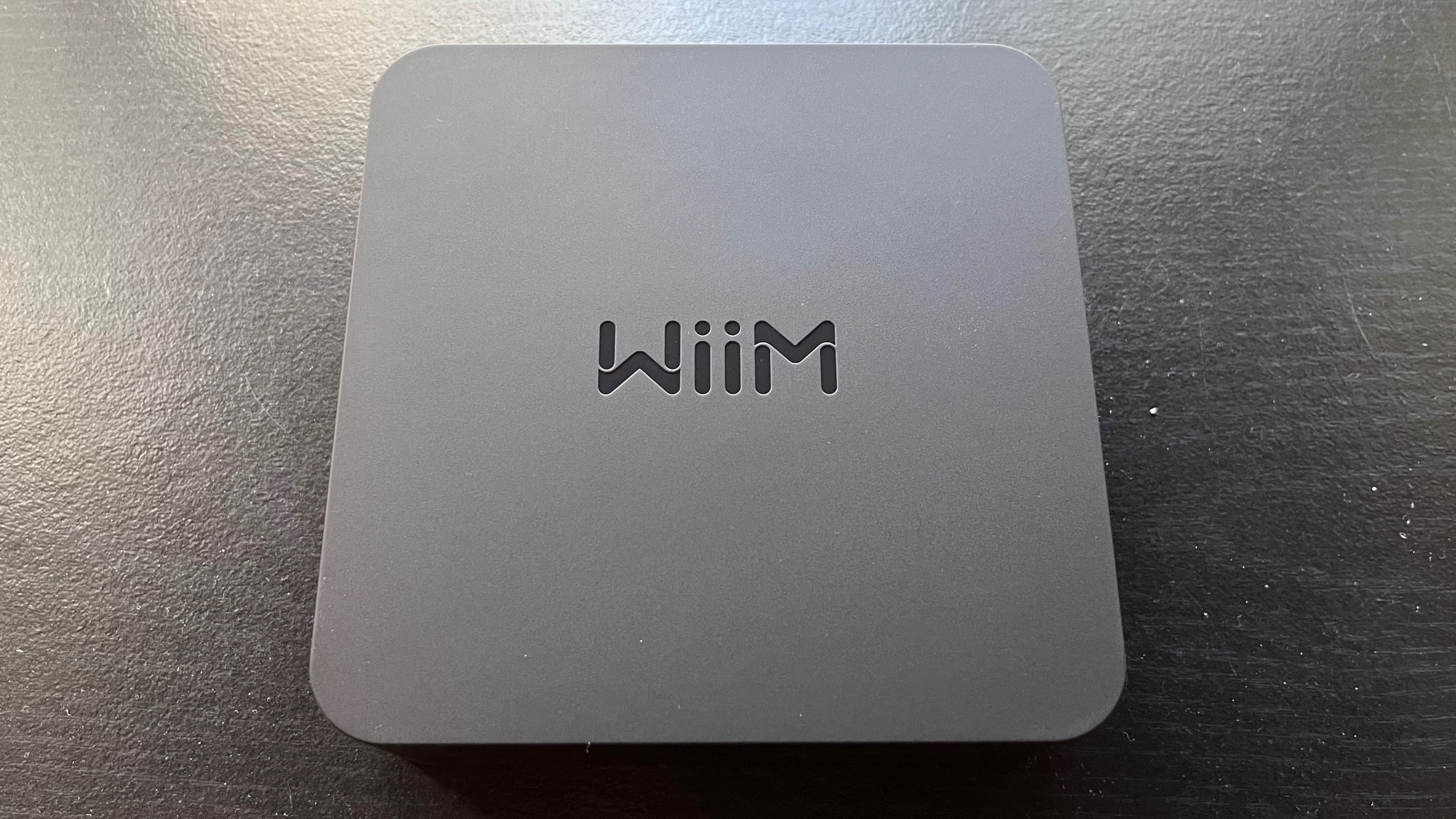 WiiM Pro streamer from above on black background