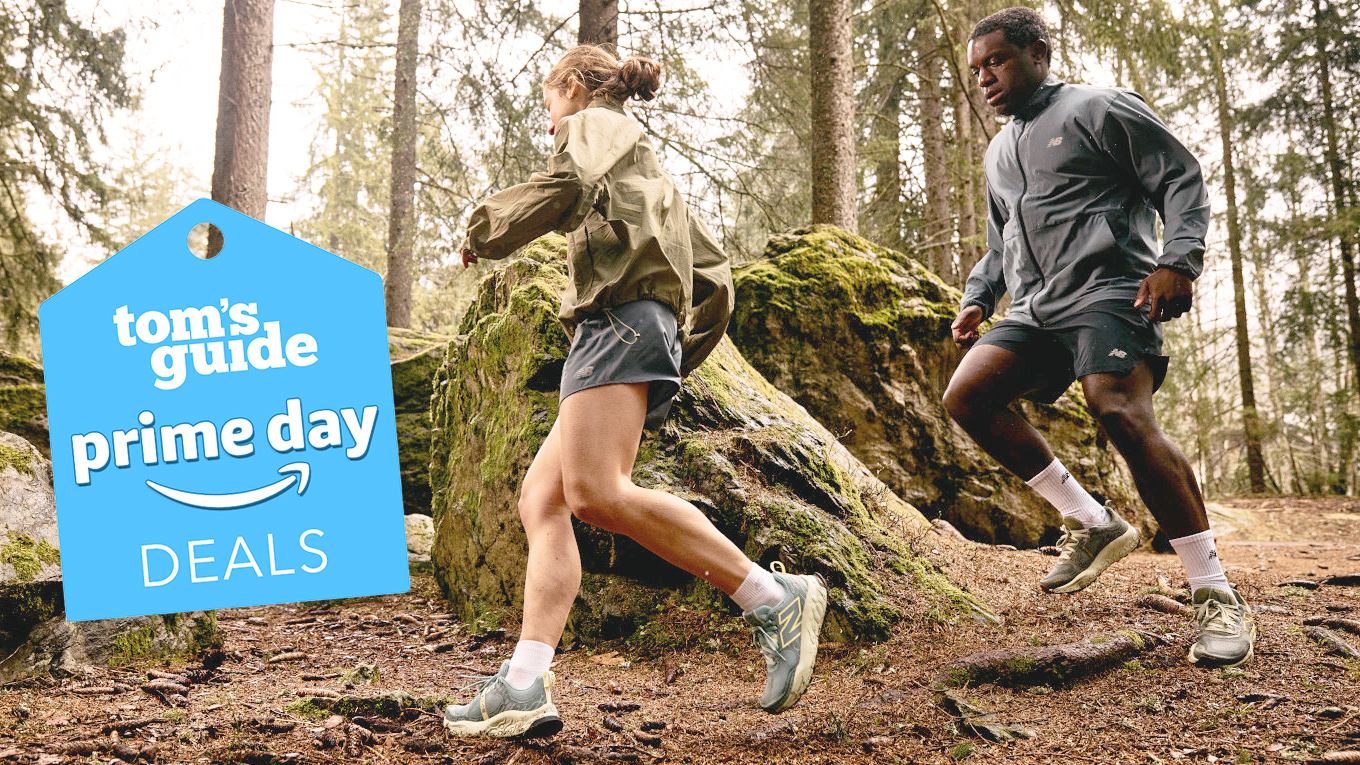 Two runners in the woods passing by wearing New Balance trail running shoes
