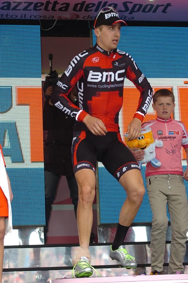 Taylor Phinney limps painfully onto the podium after his stage 3 crash