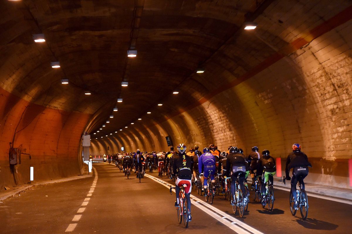 A brief respite from the rain as the peloton goes through a tunnel