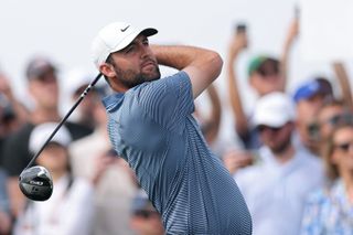 Scottie Scheffler watches his tee shot