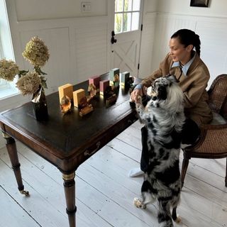 bella hadid in her farm house wearing an equestrian outfit and checking on her orebella fragrances