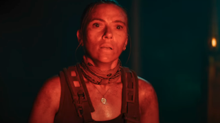 Scarlett Johansson as Zora looking terrified with a flare light hitting her in Jurassic World: Rebirth