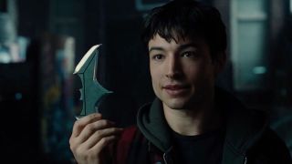 Ezra Miller's Barry Allen holding Batarang in Justice League