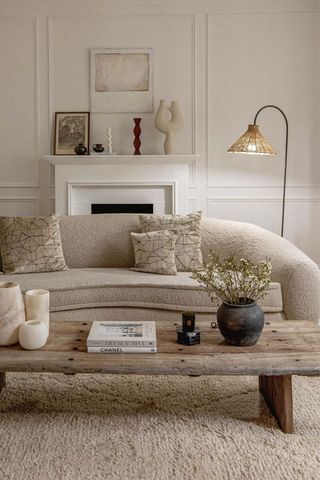 neutral living room with sofa and rattan lamp
