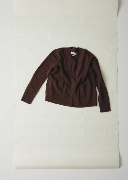 Wool Cashmere blend cardigan with deep front pockets and a boxy fit.