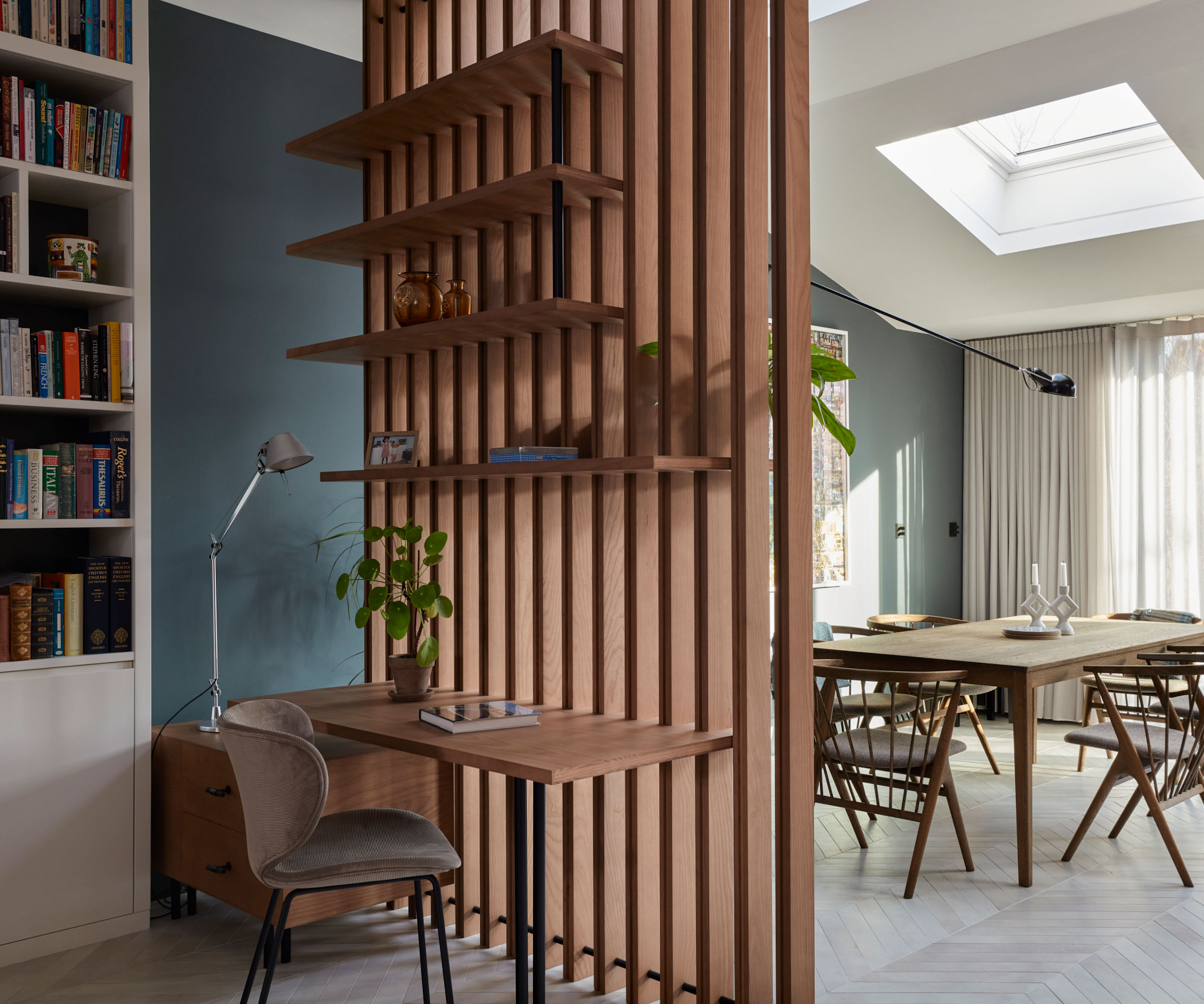 open plan home office with slatted room divider and open plan dining room