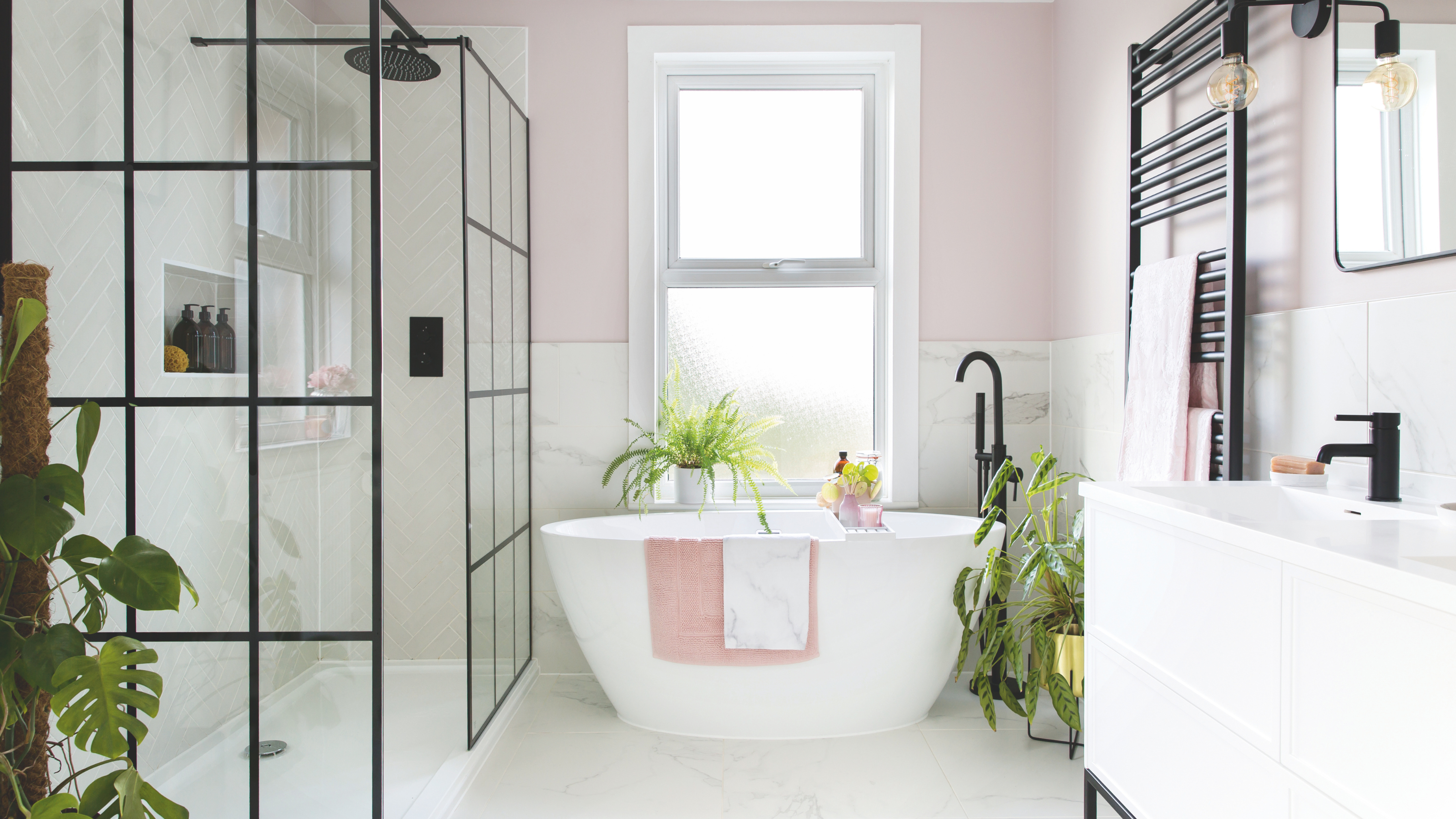 Modern white bathroom with matte black finishes.