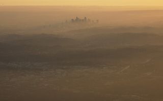PASADENA, CALIFORNIA - NOVEMBER 05: The buildings of downtown Los Angeles are partially obscured in the late afternoon on November 5, 2019 as seen from Pasadena, California. The air quality for metropolitan Los Angeles was predicted to be "unhealthy for sensitive groups" today by the South Coast Air Quality Management District.
