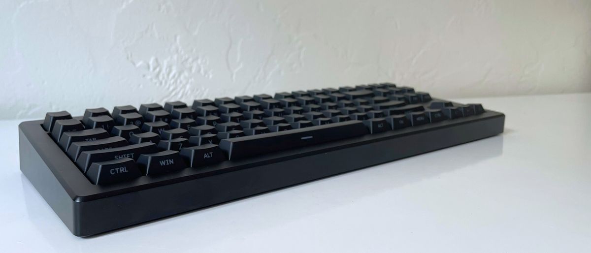 The Drop CSTM80 mechanical keyboard on a white table