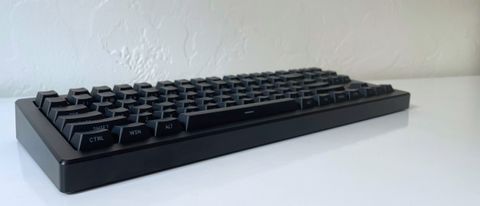 The Drop CSTM80 mechanical keyboard on a white table