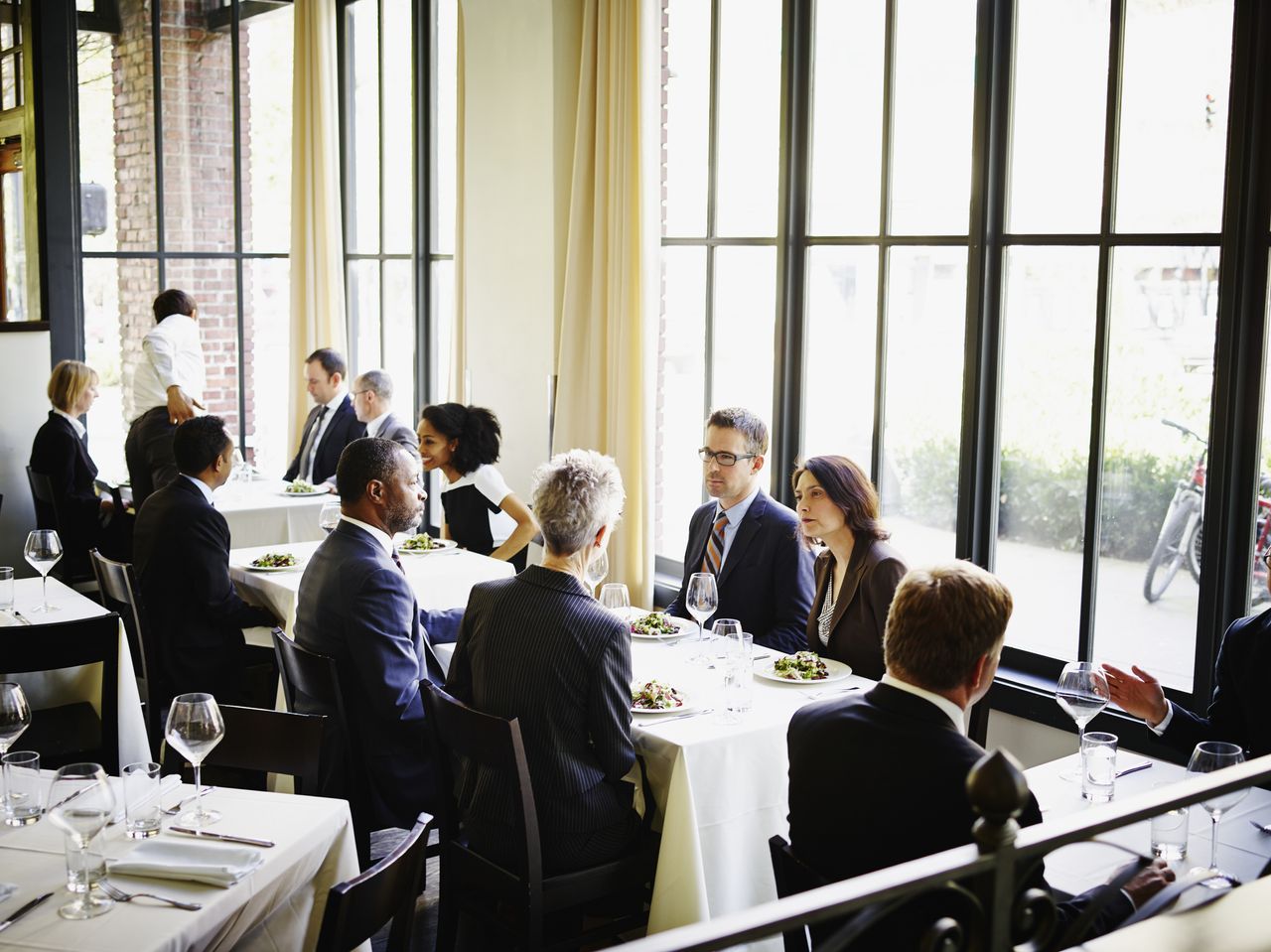 Businesspeople eating lunch together.