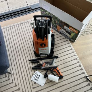 pressure washer unboxed on striped rug