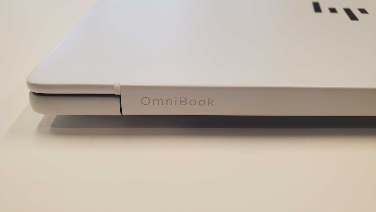 white laptop on table