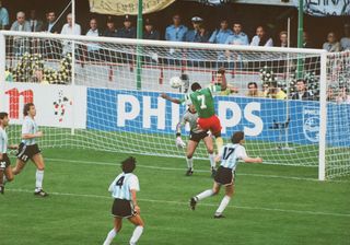 François Omam-Biyik scores a header for Cameroon against Argentina at the 1990 World Cup.