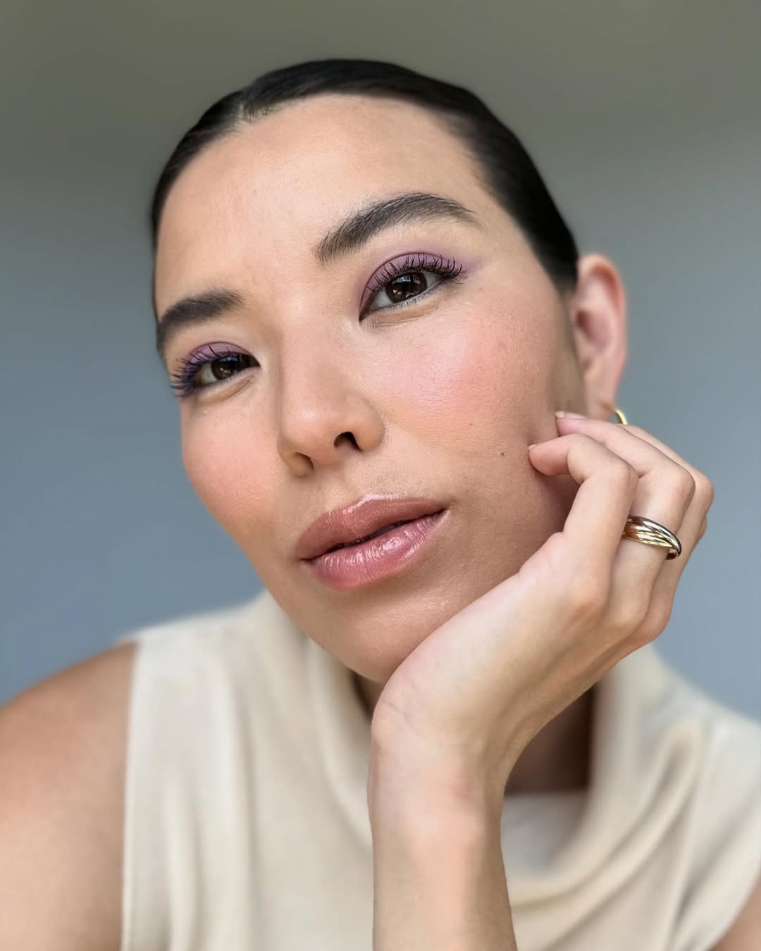 Makeup artist and content creator Marcela Alcala shows off a purple eyeshadow look