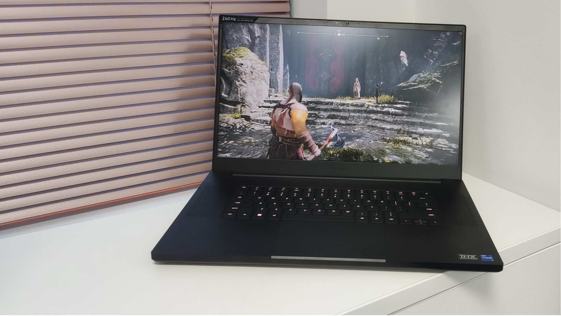 Image of Razer Blade 17 by a window.