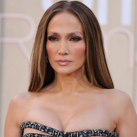 Jennifer Lopez attended Netflix's Office Romance premiere in a vintage Versace ballgown with chest cut-outs