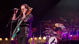 Rush's Geddy Lee (foreground) onstage with Chad Smith