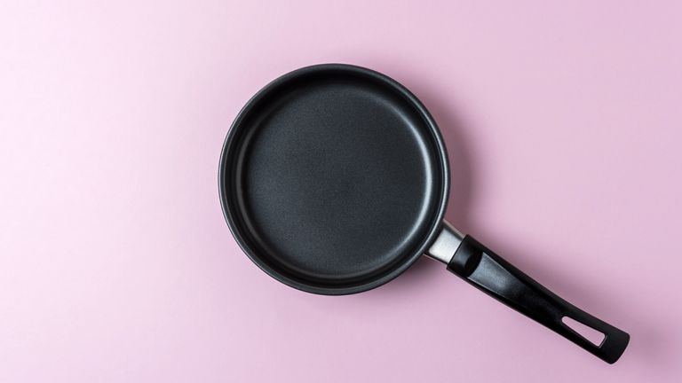 frying pan flat lay with pink background