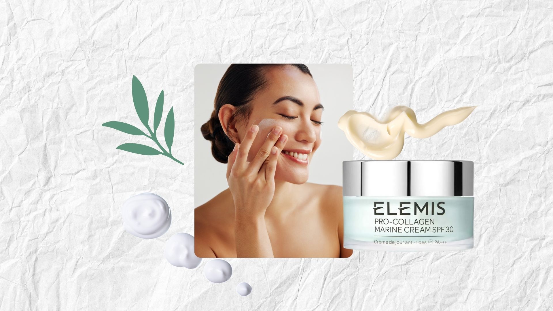 a paper backdrop with an image of a smiling model applying moisturiser plus drops of face cream and a jar of elemis pro collagen marine cream