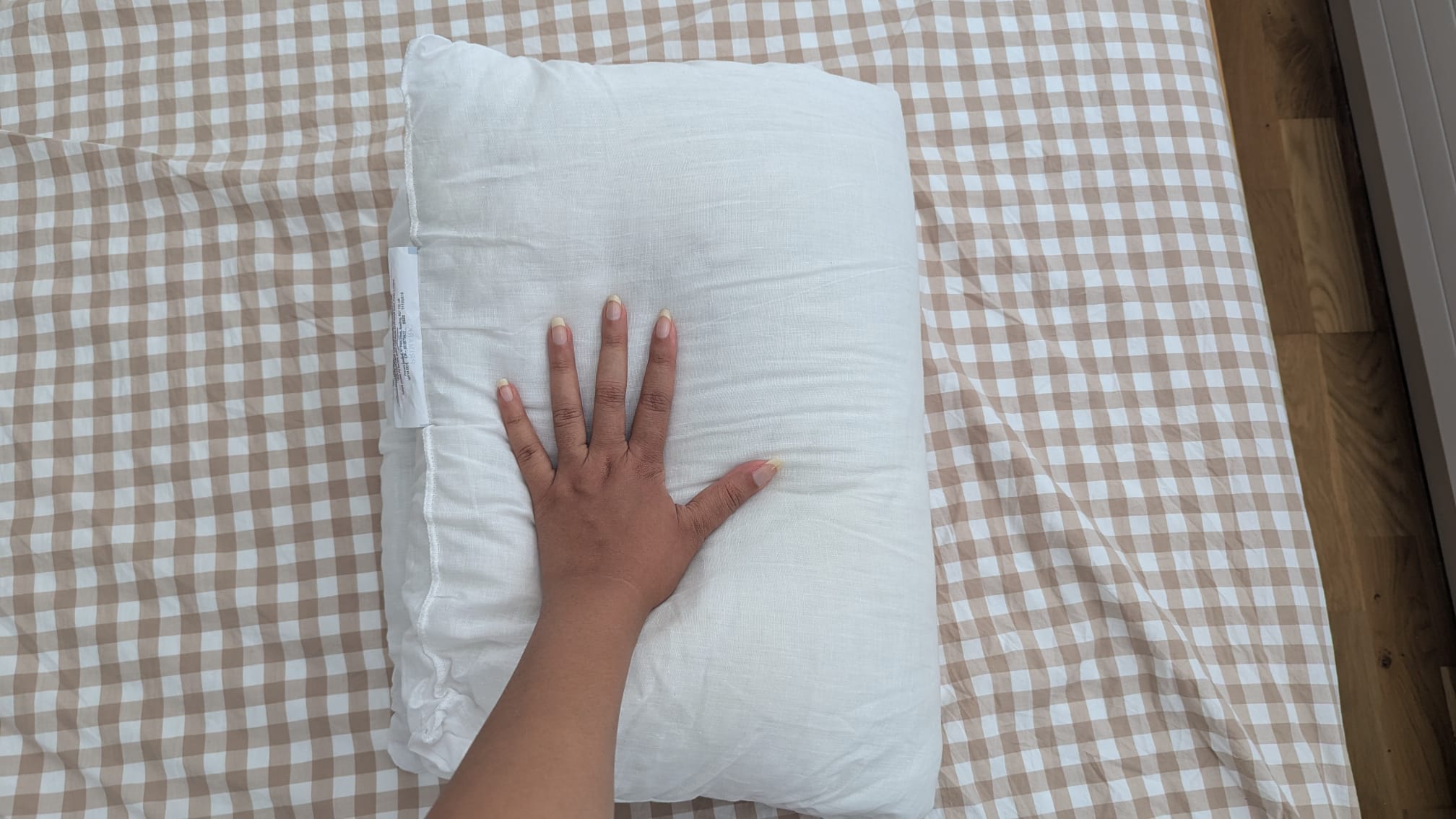 Folding the pillow in half to check its level of support